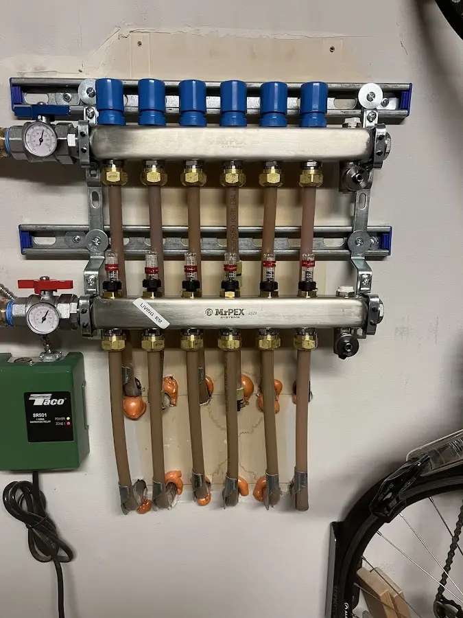 Plumber performing Water Heater Repair at a residential property in Mays Chapel